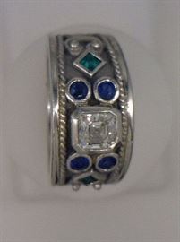 Platinum band .77 Ct asher cut diamond, emerald and sapphire band