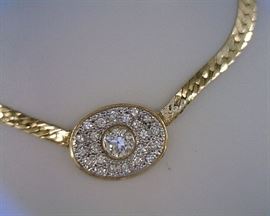 14K yellow gold diamond necklace. Center stone measures .85 ct, pave stones .75 ct