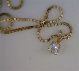 14K chain with drop diamond pendant. .20 ct diamond