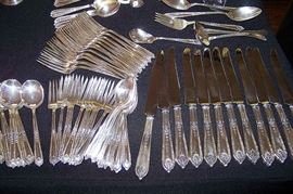 Sterling silver- service for 12 - including knifes, dinner forks, salad forks, teaspoons, soup spoons, gravy ladle, meat fork, sugar shell, two veg. spoons, butter knife. Pattern is "Della Robbia" by Alvin