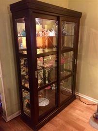 Lighted Curio cabinet with glass shelves and sliding doors