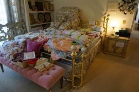 King size brass bed!  Look at the pink velvet tufted long bench seat!