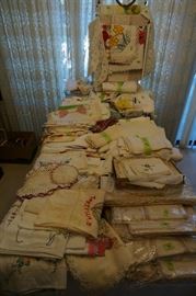 Table of antique linens.....tablecloths, runners, napkins, dresser scarfs, towels, doilies 