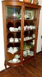 LOVELY CARVED TIGER OAK CLAW FOOT CURVED GLASS CURIO CABINET