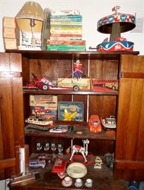 PLANKBOARD ARMOIRE FILLED WITH OLD TOYS