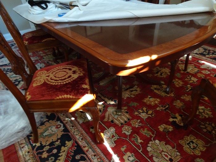 74"L X 47"W Banded Mahogany Double Pedestal Dining Table with some damage to top. - two leaves measuring 17" each.