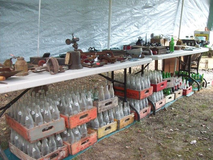 Old tools, cases of bottles