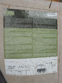Label on back of yellow and red rug