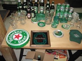 Collection of various Heineken beer cans,bottles , ashtrays , glasses and more