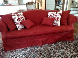 Slip-covered camel back sofa