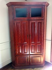 Oak corner television cabinet with bi-fold and glass doors