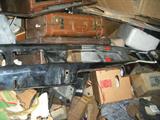 One of the piles in the garage. lots of hiding places. check out the chrome car bumper.