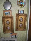 limoge plaques in gold frames, butterfly art, small painting and mirror.