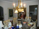 Dining set and stuff on its all for sale. Light fixture is for sale. Miro in the background has sold.