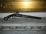 It's real. Pirate's flintlock.