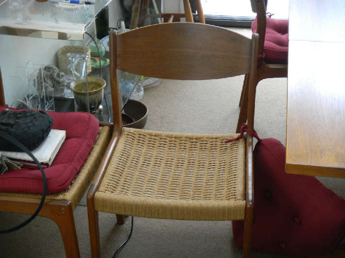 ONE OF THE SIX ROPE CHAIRS.  CHAIRS HAVE ALWAYS HAD PADS COVERING THE ROPES.