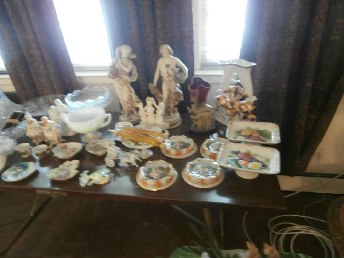 JUST SOME OF THE GREAT GLASSWARE, INCLUDING HULL, CAPODIMONTE, AND OTHER FINE GLASS.  THERE'S CUT CRYSTAL AND MORE, LOTS OF BRIC A BRAC.