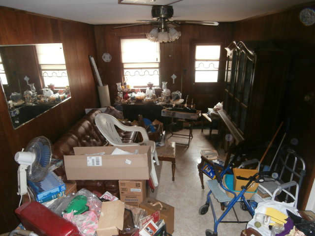 This is the den.  Its cluttered.  Come declutter it. We'll give you good prices.