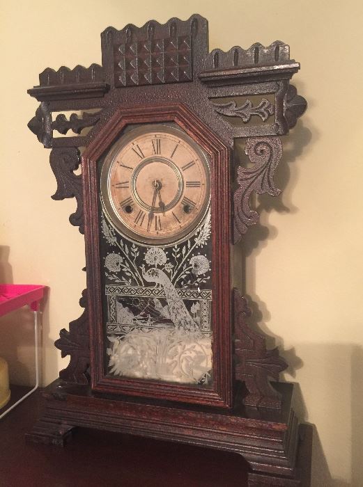 Vintage clock with peacock on glass