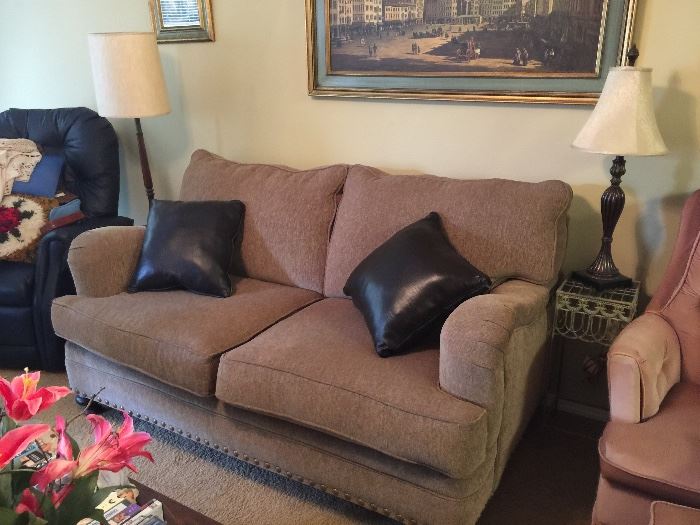 Loveseat with lovely neutral fabric and nice details