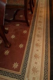 showing one side of the rug under the dining table