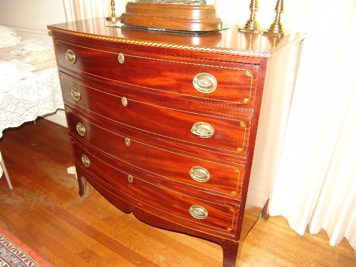 Important mid 19th century Southern inlaid bow front chest 