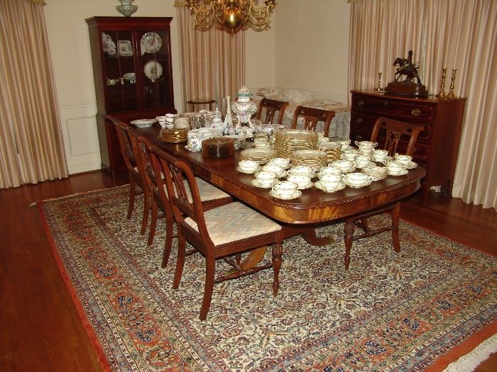 Dining room with furniture and like new Oriental rug. 