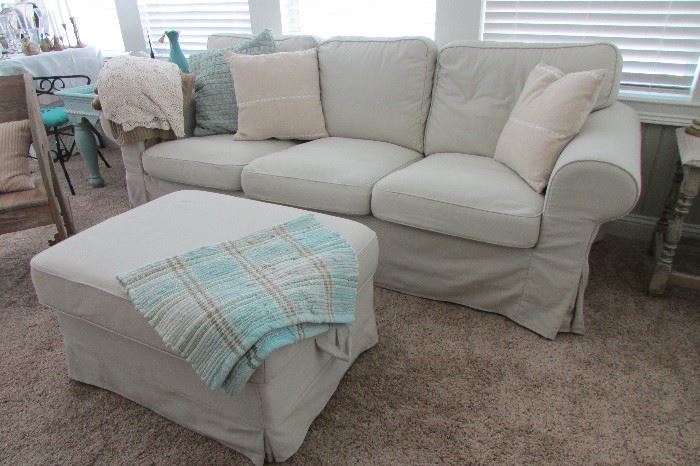 Slip covered sofa, loveseat and ottoman