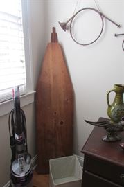 Dyson vacuum cleaner and vintage wooden ironing board