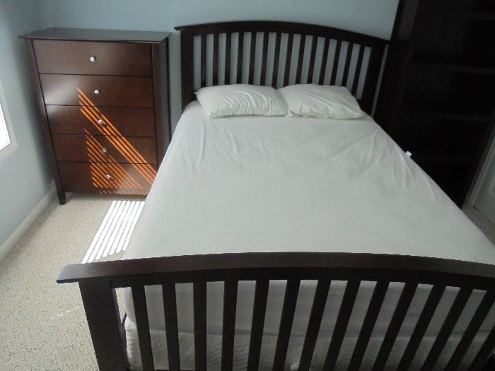 Full size bed in guest room... "mattress slept on 4 times". 5 drawer highboy dresser