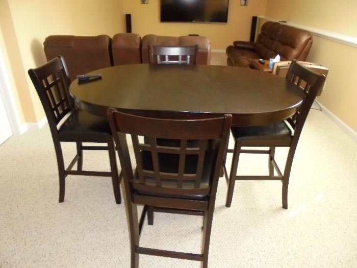 Bistro type table and 4 chairs. Leave removes to make this a round table