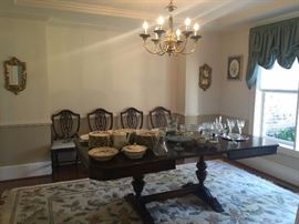 Mahogany dining room table and four chairs, china, crystal, and silver. Lovely 8x10 rug as well!