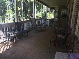 Several sets of patio furniture and decor