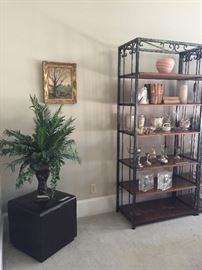 One of two matched contemporary ottomans and display shelves
