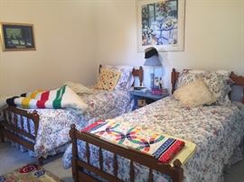 Pair of twin beds and a cute shabby chic nightstand