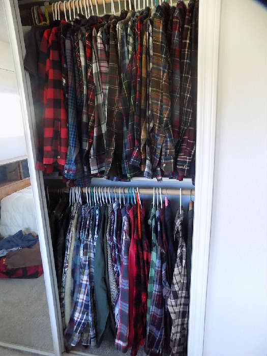 huge sliding closet filled with mostly never worn flannel shirts, coats, T-shirts , Size Medium. $3 each.