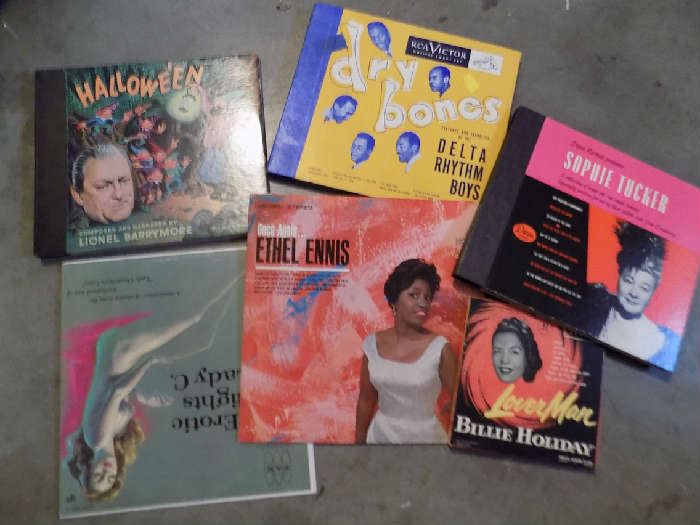 many records in smaller garage most are $2- $3  Below in record cabinet are Duke Ellington, Bing Crosby and that era in heavy records files. Three boxes of mostly western LP'S.  