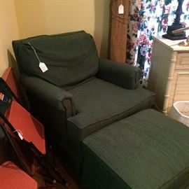 Comfortable dark green club chair and ottoman