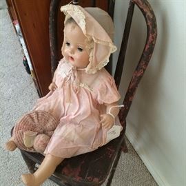 Vintage doll in child's chair