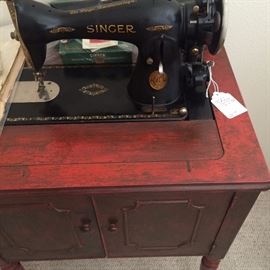 Singer sewing machine in cabinet