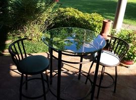 bistro table with glass top and 2 chairs