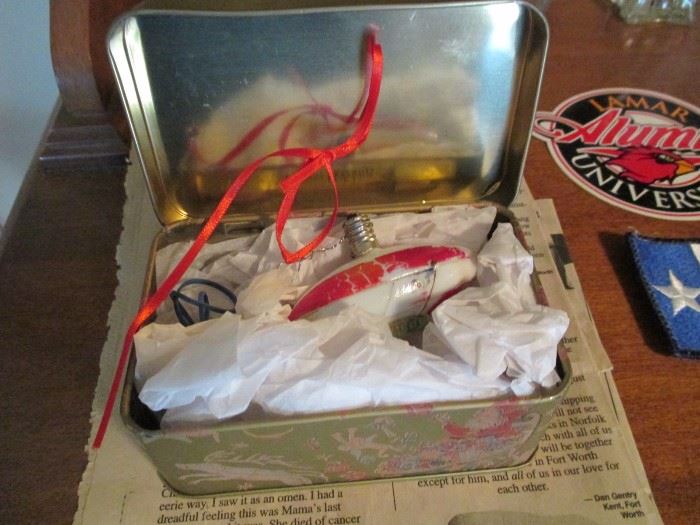 antique Blimp Christmas light bulb made into an ornament in storage tin