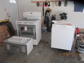 Kitchen ceramic top stove, overhead microwave and dishwasher less than 5 years old