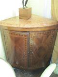 Low corner cabinet with pink marble top, mid-19th century, French or Italian.