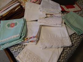 Group of crocheted pillow cases.