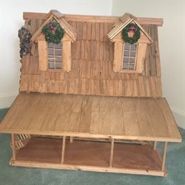 Three-part rustic doll house with porch.