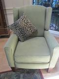 Sage green modern chair with small wings and roll arms. An any room chair