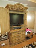 Armoire open to reveal 36" flat screen TV