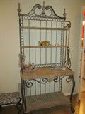 Wrought Iron and Rattan Bakers Rack; heavy iron finials in the country French style; has matching chest of rattan