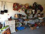 Xmas wreaths, garlands, ladies purses on wicker shelf unit' pet travel kennel